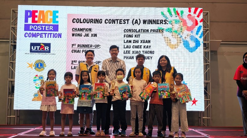 Group photo of the winners of Category A (Colouring Contest) with the organisers and distinguished guests