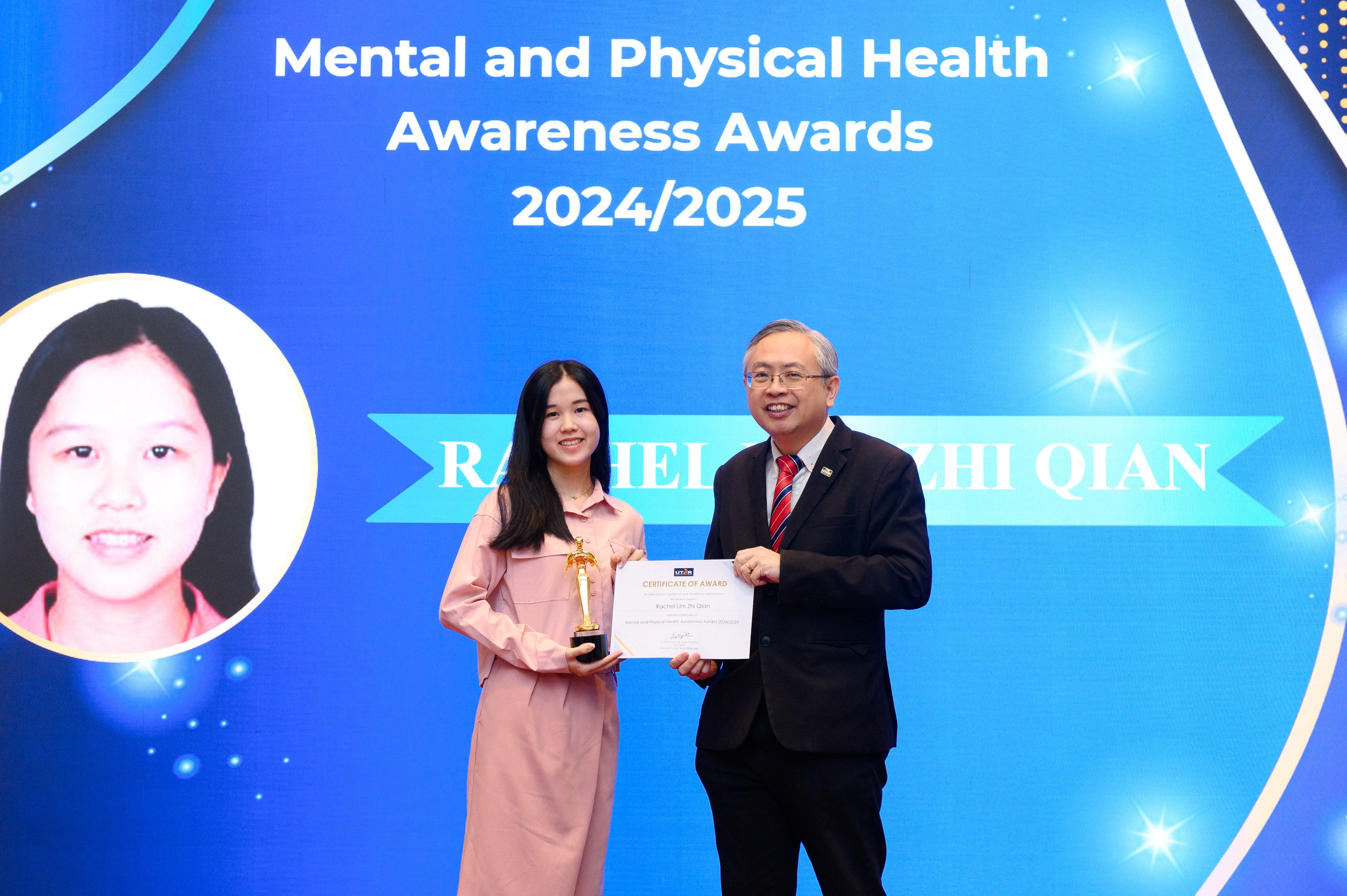 Ms Rachel Lim (left) receiving her award