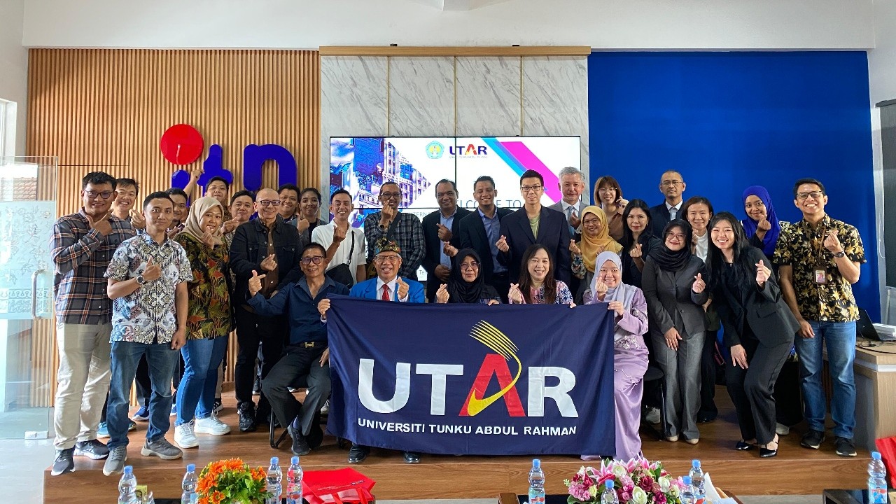 Group photo of panellists, committee members, and participants at the International Real Estate Development Forum 2025, featuring Prof Dr Ir Sutanto Hidayat, Head of Programme (from left), and Prof Dr Ir Lalu Mulyadi, MT, Postgraduate Director (second from left)