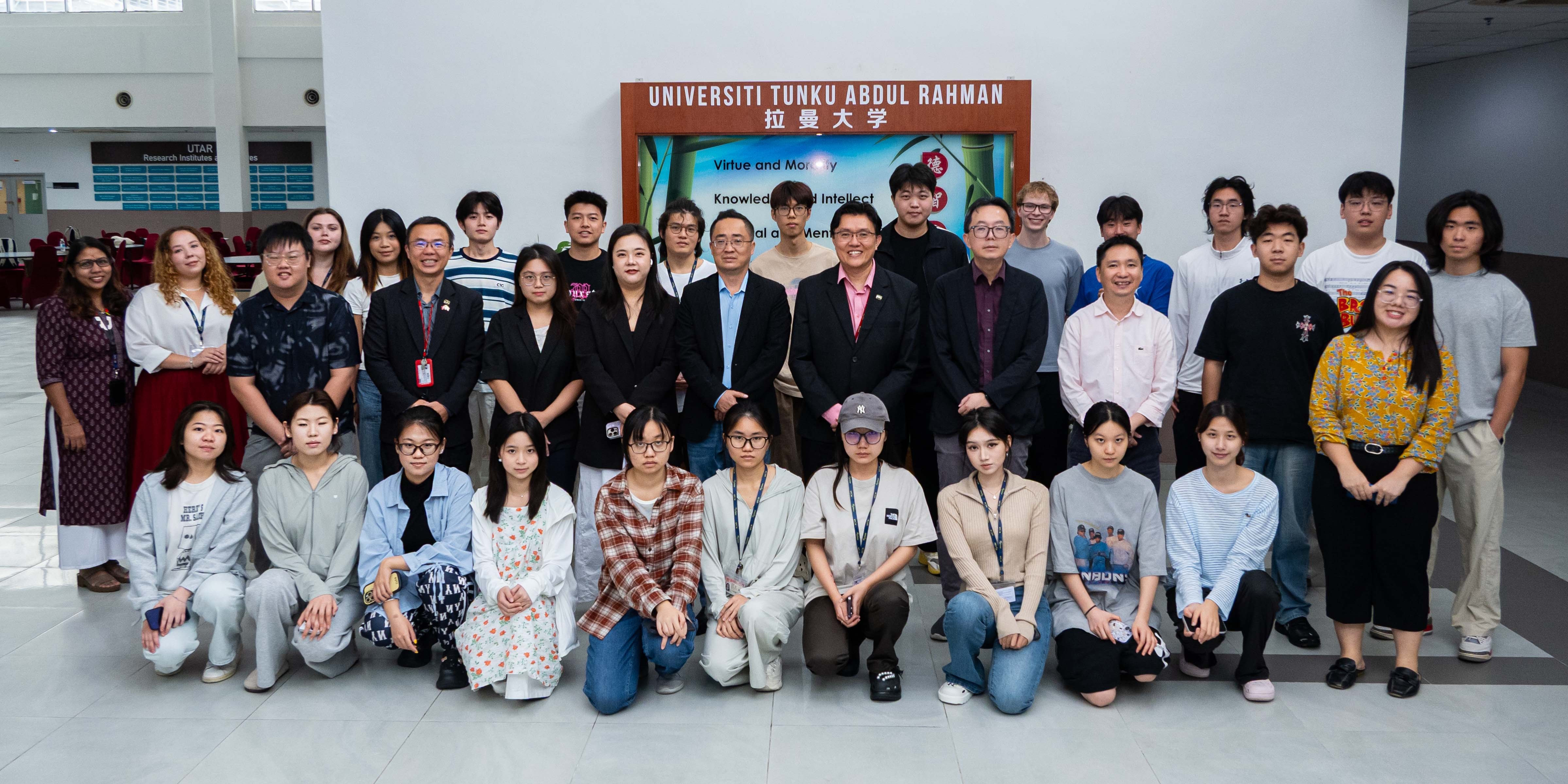 Group photo of UTAR staff and exchange students at the event
