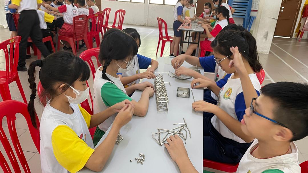 Students of SJK(C) Chung Huah, Kampar, learning about magnetism by building their own magnets during the STEM activity 
